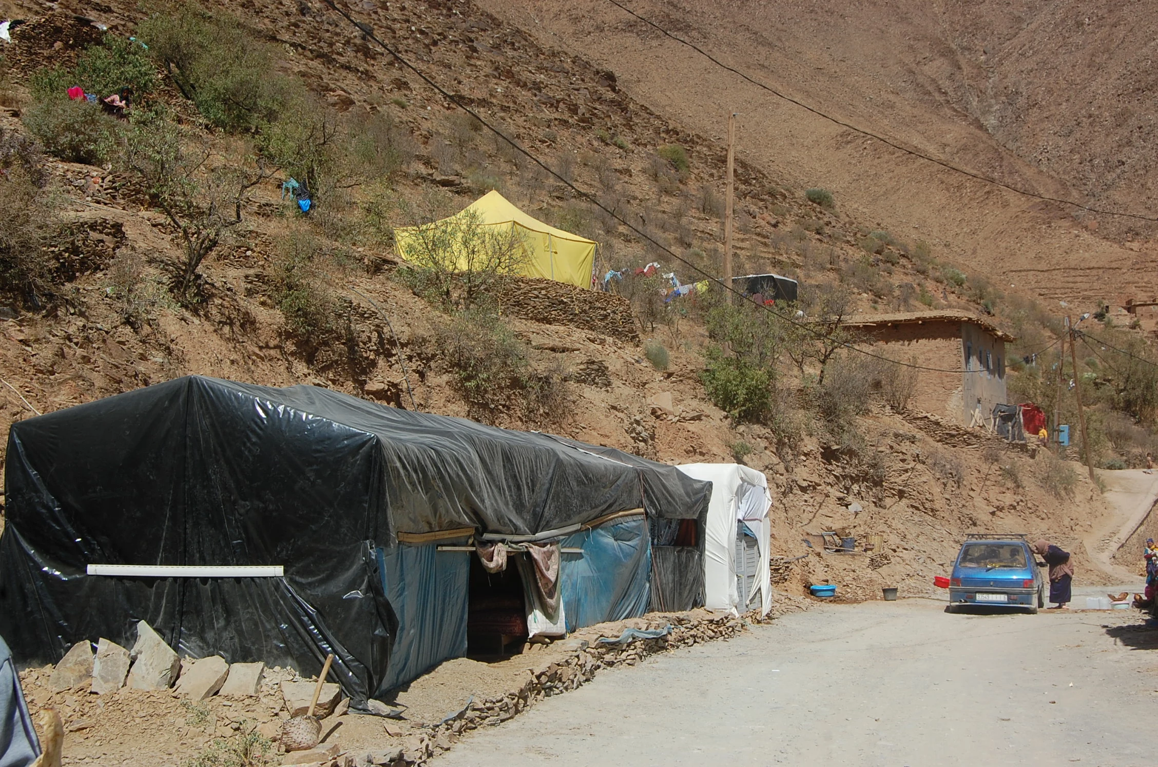 Temporary shelters along the road in Timslah, Al Haouz, October 2023