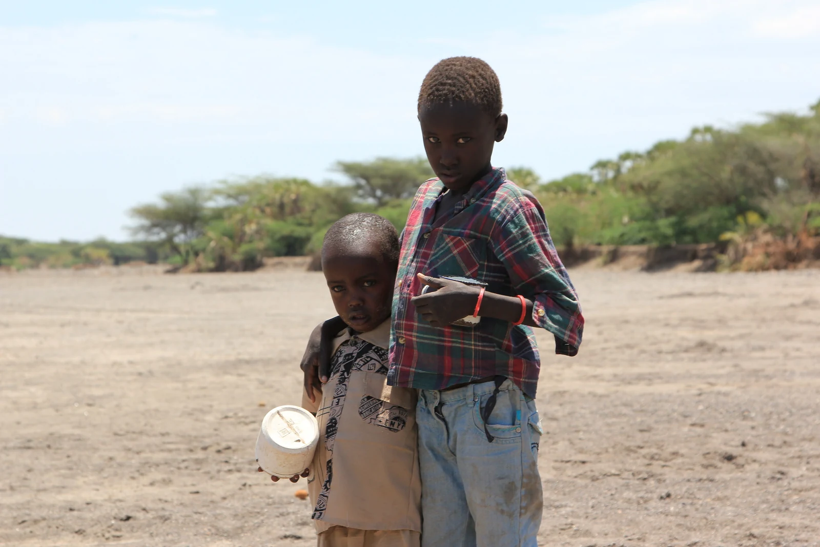 Two brothers search a dry riverbed for water near Kataboi, Turkana, 2011