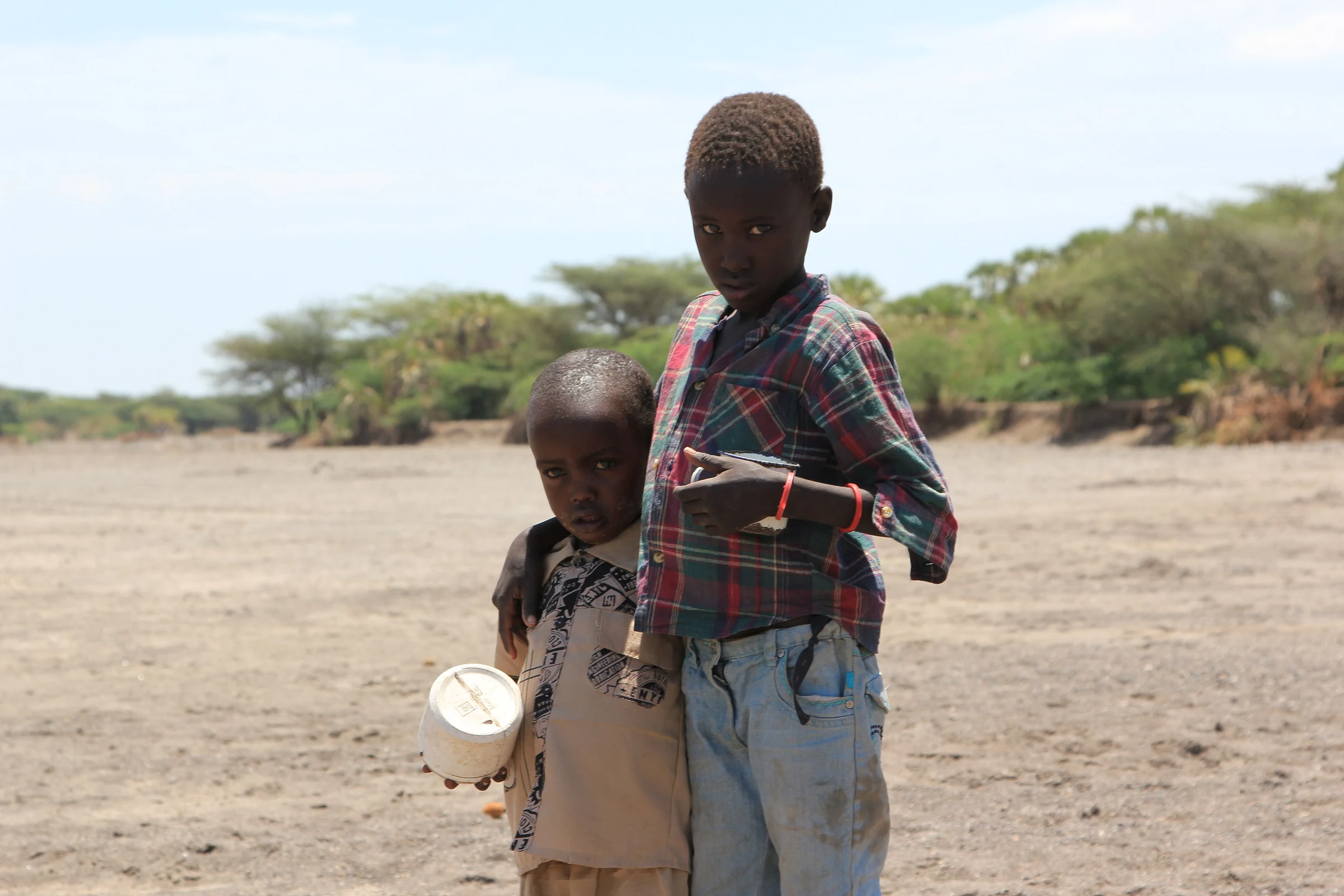 Two brothers search a dry riverbed for water near Kataboi, Turkana, 2011
