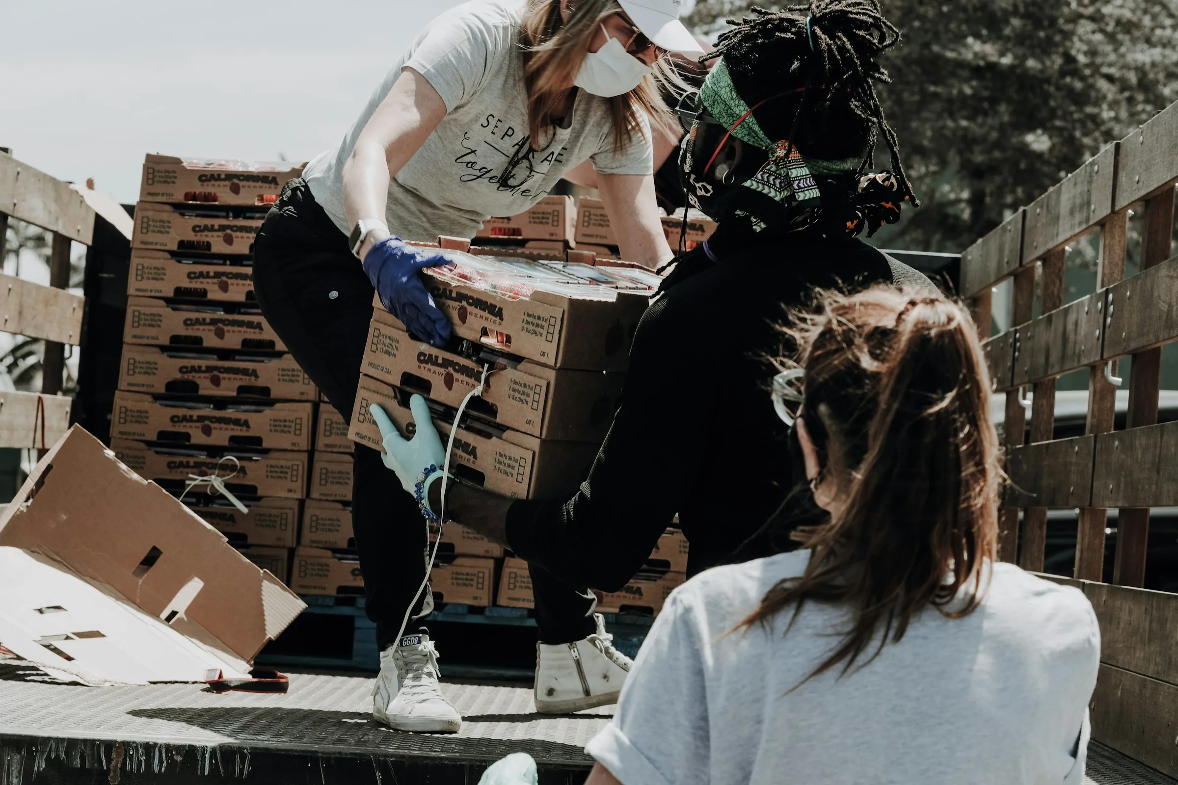 Volunteers loading boxes of supplies